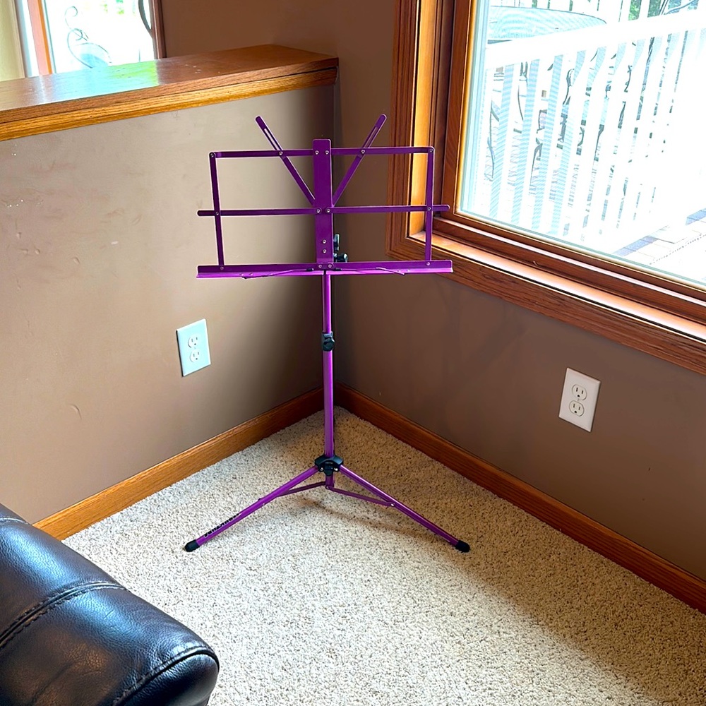 Music stand with case, tuner, slip stop, and string cleaner fabric